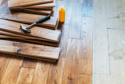 The process of house renovation with changing of the floor from carpets to solid oak wood. Beautiful golden handscraped oiled European oak brushed for added texture and fine definition of wood grain